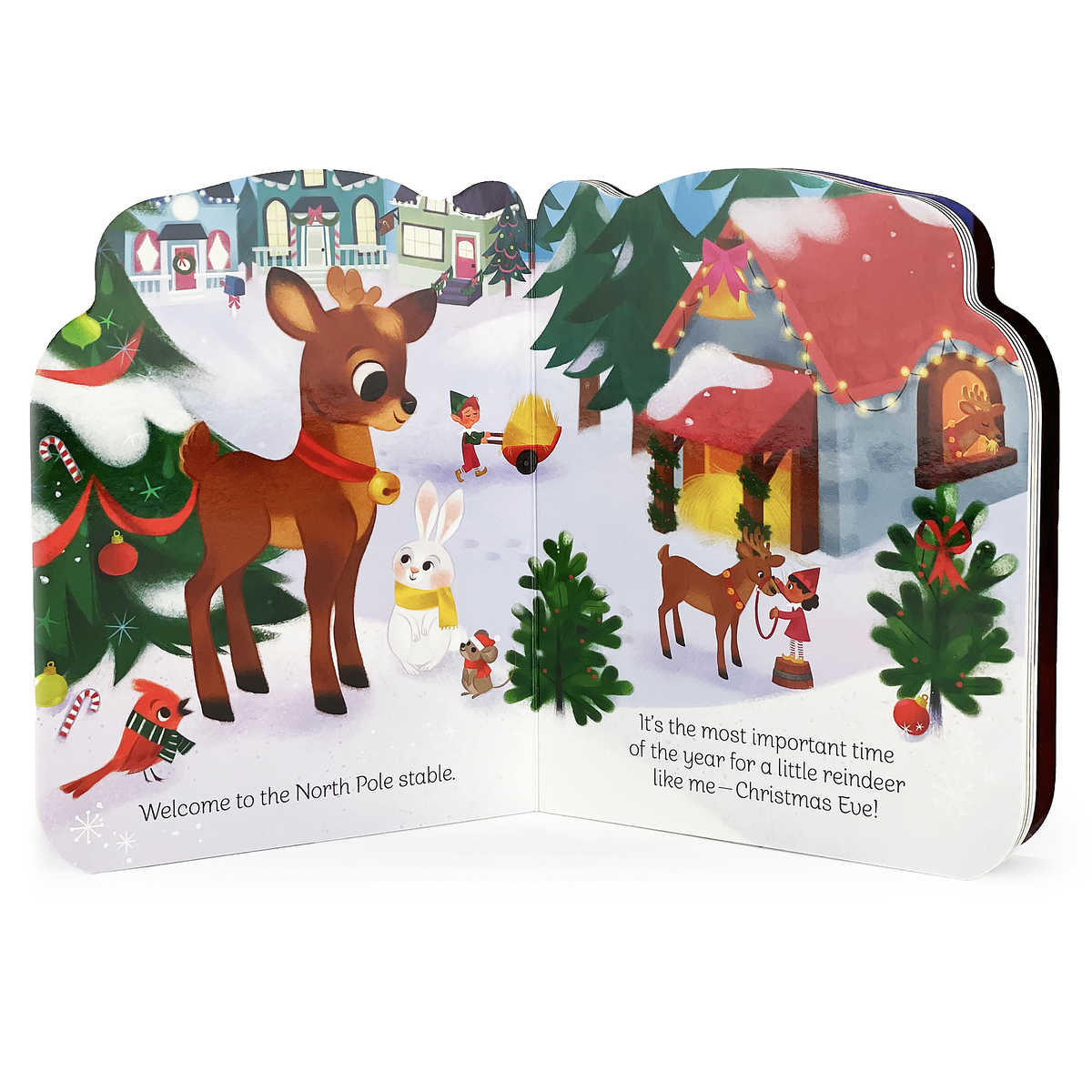 Open board book shaped like Santa’s sleigh, featuring a reindeer, a rabbit, and a gnome in a snowy North Pole scene with holiday decorations and text.