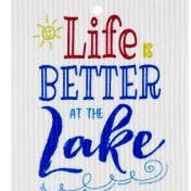 The Dish Cloth: Life is Better at the Lake Swedish Dish Cloth features a colorful text with a sun drawing, adding vibrant charm to your kitchen. This super absorbent, biodegradable cloth is both eco-friendly and decorative.