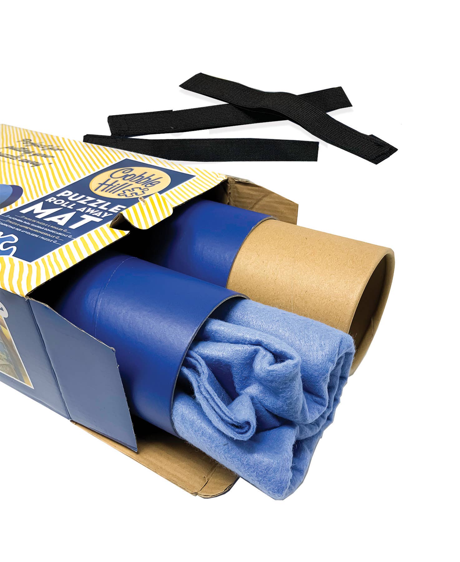 Two Puzzle Roll Away Mats, in blue and similar to yoga mats, are partially rolled and packaged in a cardboard box, with black straps placed beside them.