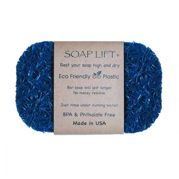 A blue Soap Lift with a textured surface and a brown label attached.