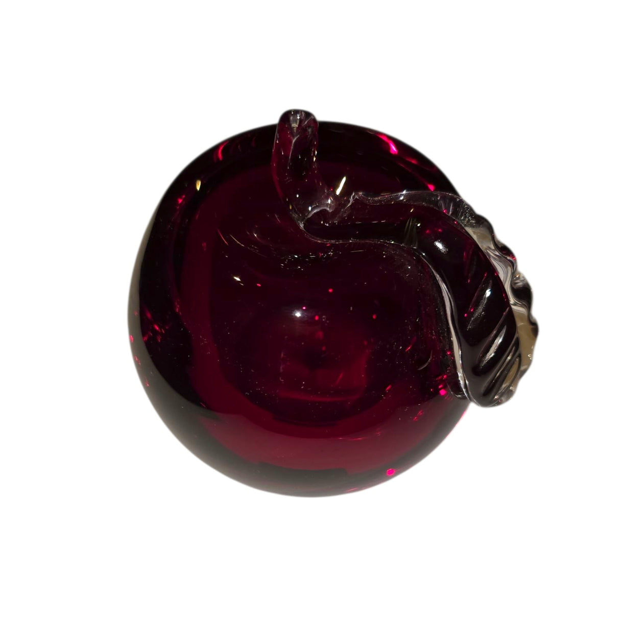 A 3-inch-tall, mouth blown Red Apple from Mantorp Glass, Sweden, with a curved stem and rich dark red color, shown against a white background.