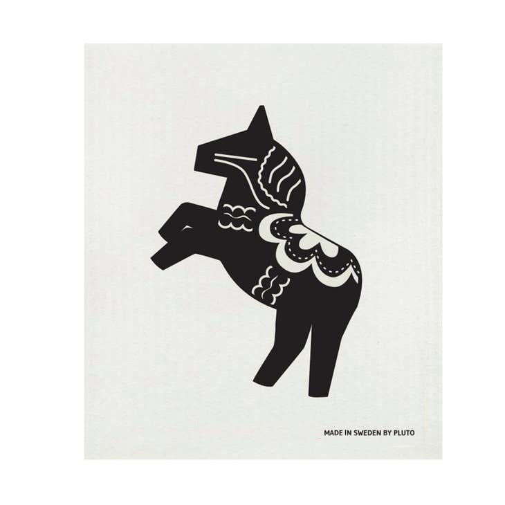 The Dish Cloth: Dala Horse Rearing Black on White Swedish Dish Cloth features a black silhouette of a decorated horse with one raised leg on white, with "MADE IN SWEDEN BY PLUTO" at the bottom; eco-friendly like traditional Swedish dish cloths.
