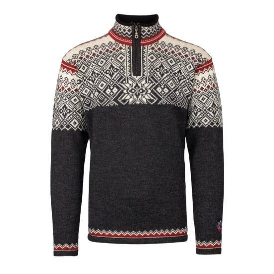 The Norlender Knitwear Narvik Ski Sweater (312) in Charcoal is a long-sleeved Nordic wool sweater with white and red patterns on the chest, shoulders, and collar, plus a quarter-zip front inspired by classic Norwegian style.