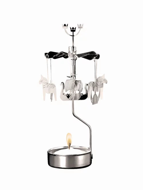 The Sweden Rotary Candle Holder Silver emulates the classic design of Angel Chimes, featuring silver animal-shaped ornaments that elegantly spin above a lit tealight candle. Expertly crafted, this delightful piece embodies the essence of Swedish craftsmanship.