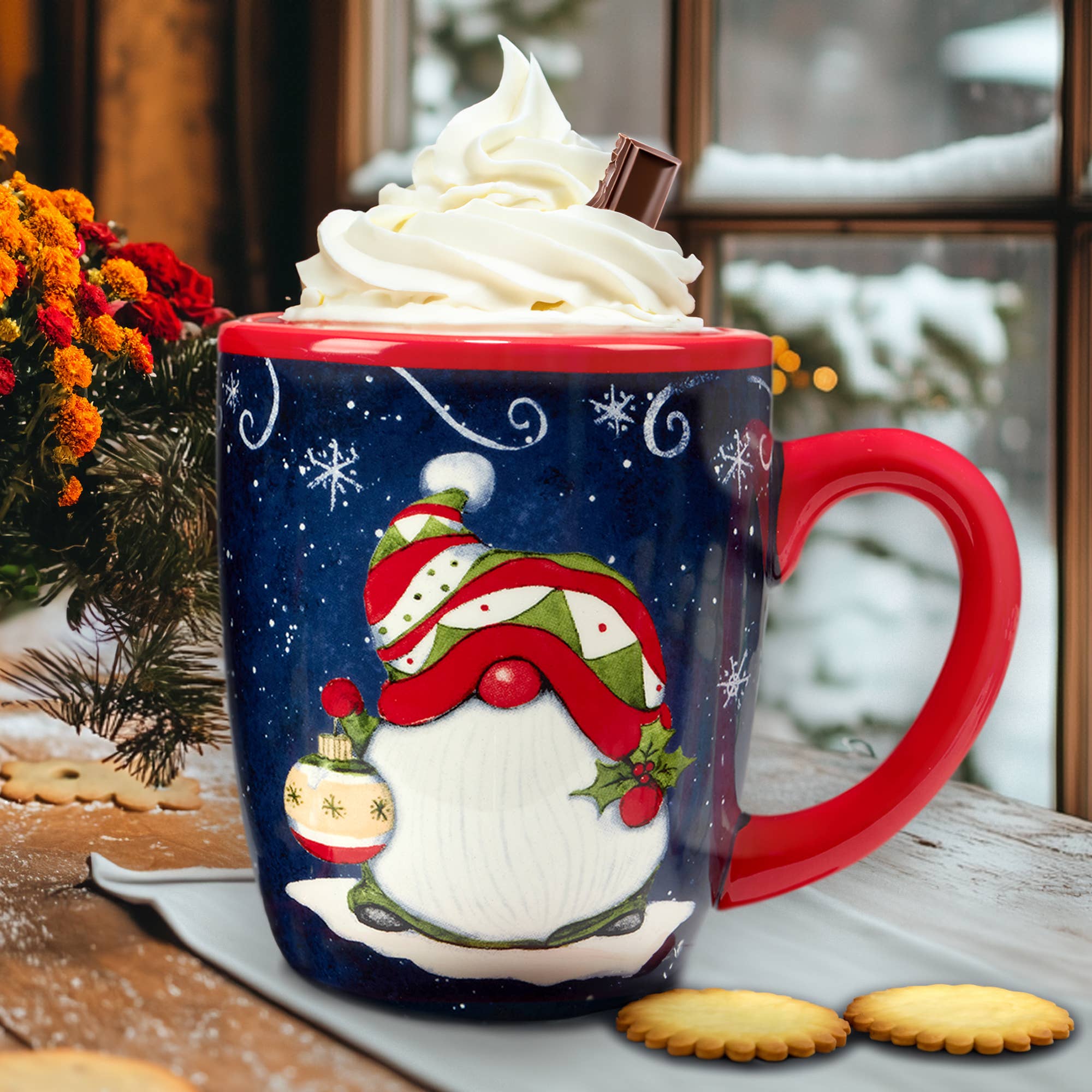 The Mug: Holiday Magic Christmas Gnomes – Ceramic Mug (18 oz.) holds a hot drink with whipped cream and a chocolate stick, set on a tray with cookies, while snow falls outside the window.