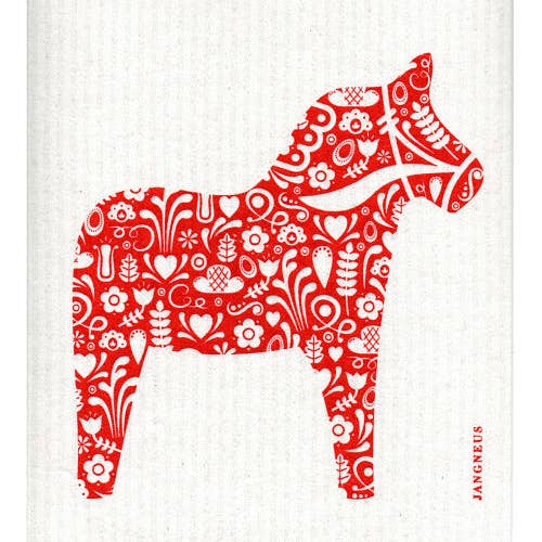 The Dala Horse Red Dish Cloth showcases a red and white decorative pattern with a horse silhouette, complemented by floral and heart motifs, all crafted on environmentally friendly Swedish dish cloths.