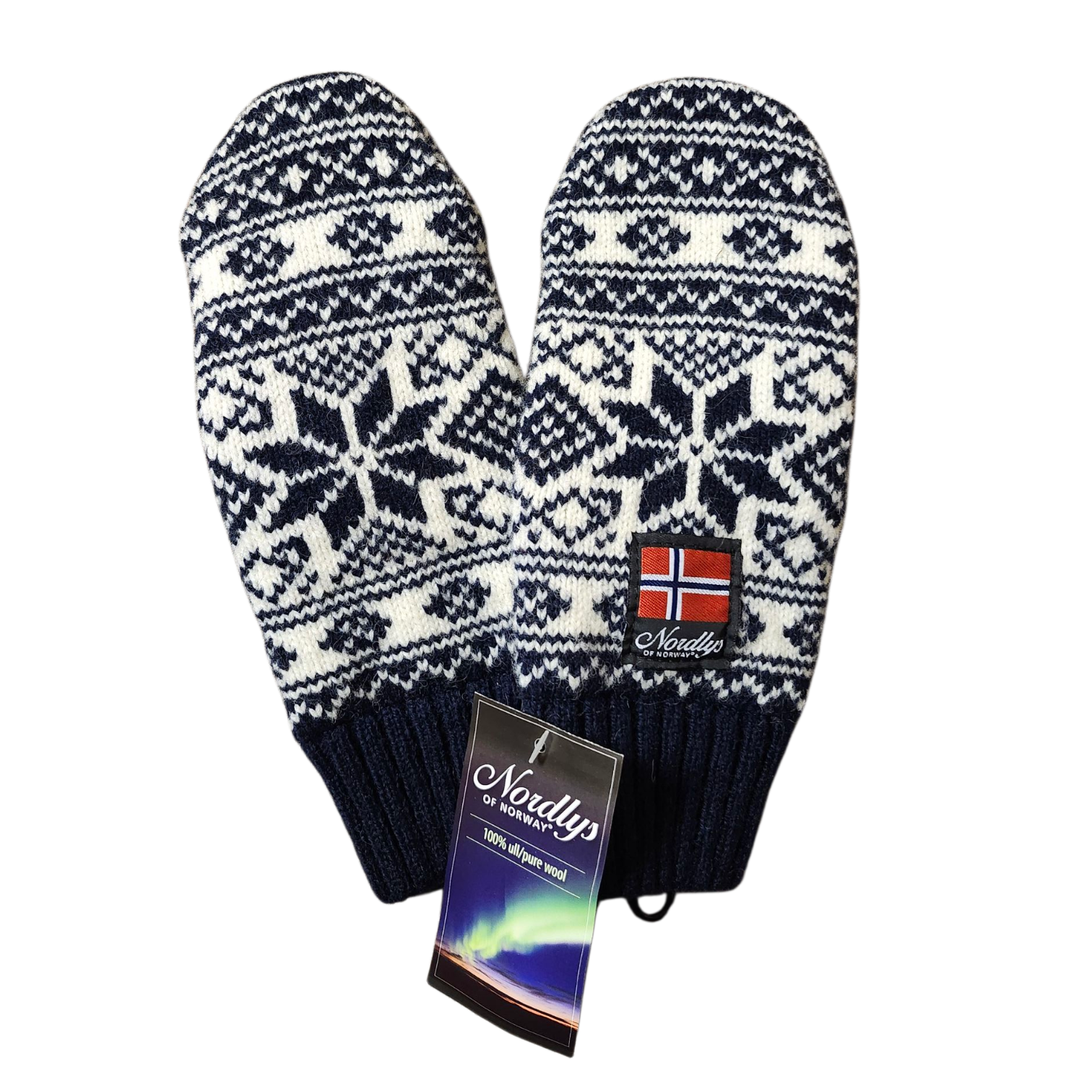 Norwegian Selbu Star Knit Mittens (Navy) by Nordlys of Norway—knitted mittens with blue and white Scandinavian patterns, a Norwegian flag patch, and a “Nordlys 100% Norwegian wool” tag.