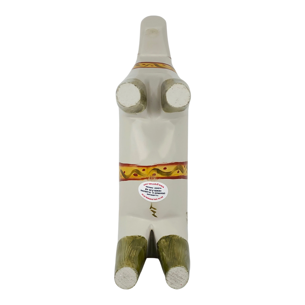 White abstract Dala horse figurine lying on its back, with four visible legs, decorative bands on the body, and a round sticker on the belly.
