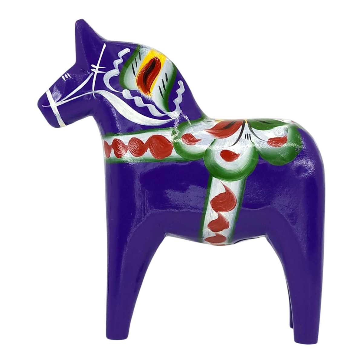 Purple Swedish Dala horse carved from pine wood, featuring painted green, red, white, and yellow decorative patterns on its body.