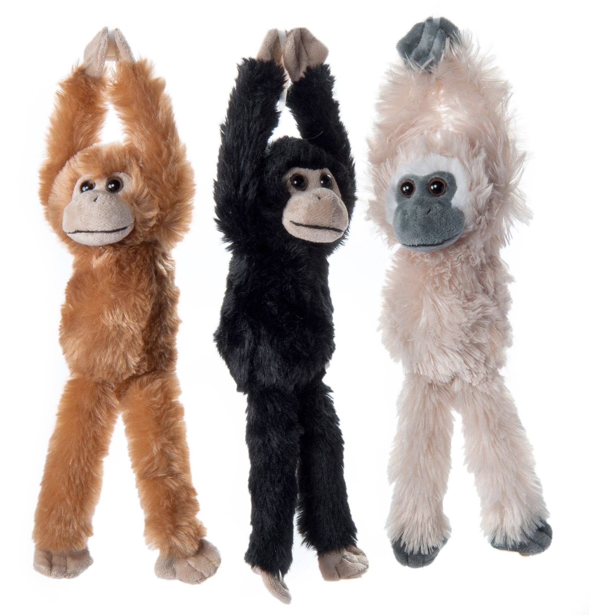 Three Plush Hanging Monkeys in natural brown, black, and white stand side by side. Each is 14 from toes to velcro hands (body 6 long). Crafted from recycled materials for eco-friendly fun.