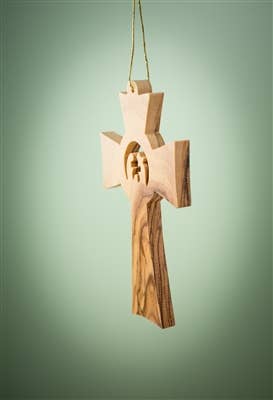 The 3.5" Cross with Holy Family Christmas Tree Ornament is a meaningful keepsake, beautifully handcrafted from olive wood in Bethlehem.