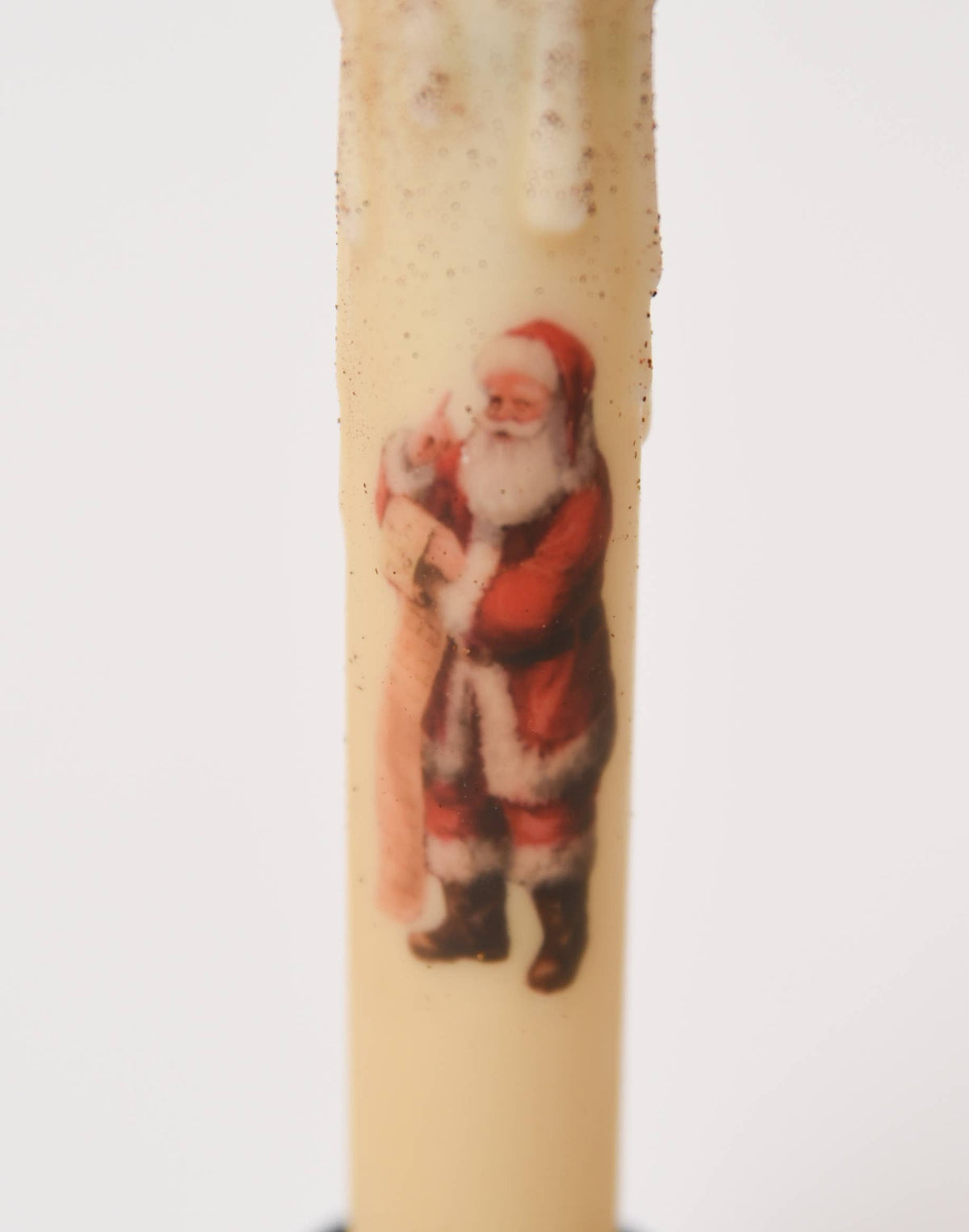 Ivory LED taper candle with a vintage illustration of Santa Claus holding a long list.
