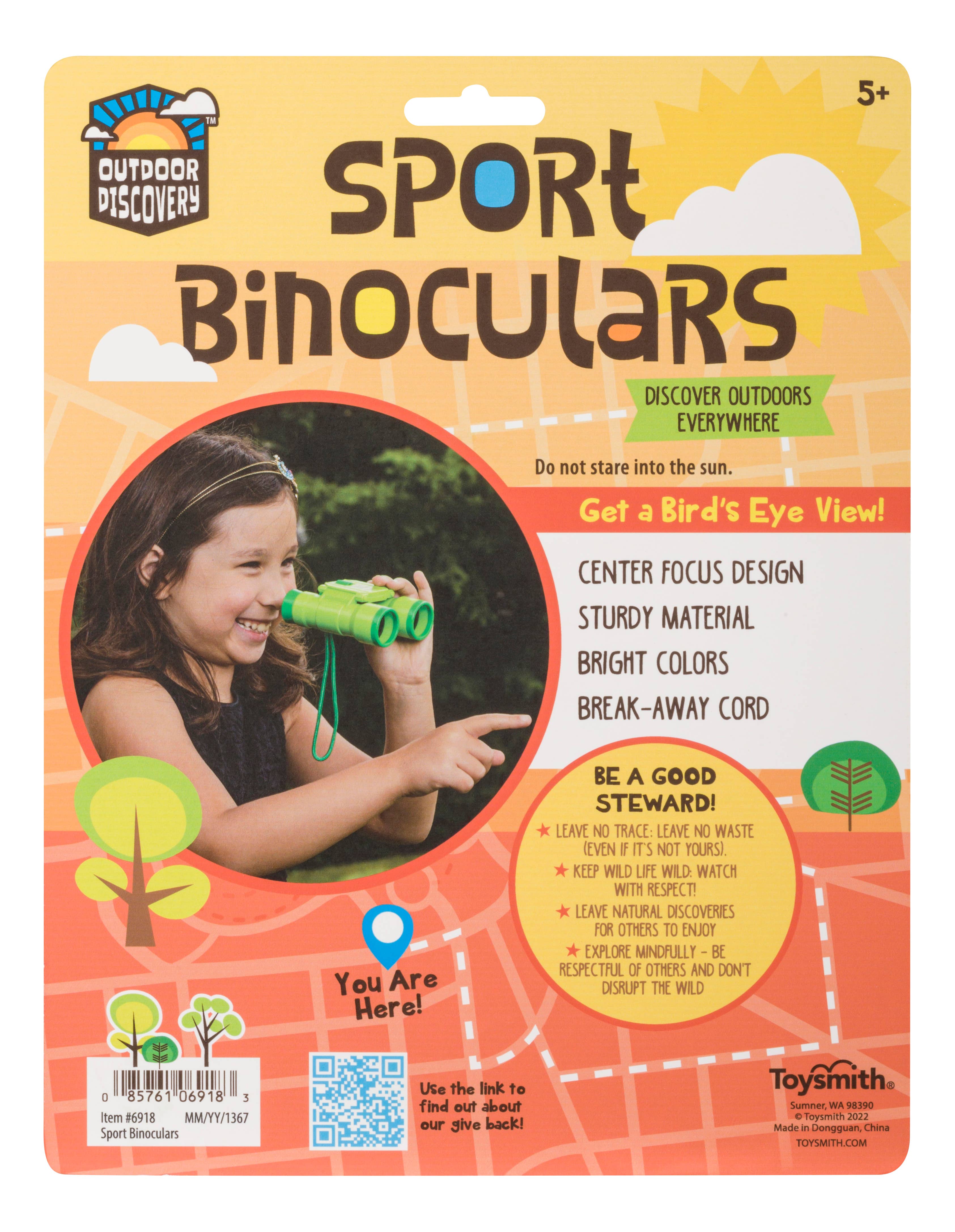 A child explores outdoors with Toy: Sport Binoculars 4x Magnification 30mm. Featuring sturdy material, bright colors, a break-away cord, and packaging that promotes discovery for ages 5+. Ideal starter binoculars!.