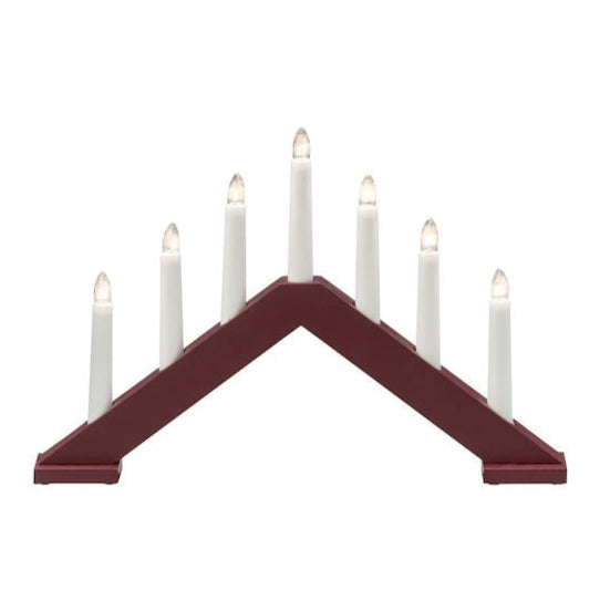 The Konstsmide - Johanna candelabra, with its matte dark red triangular design, beautifully showcases seven white electric lights, creating a stunning contrast.