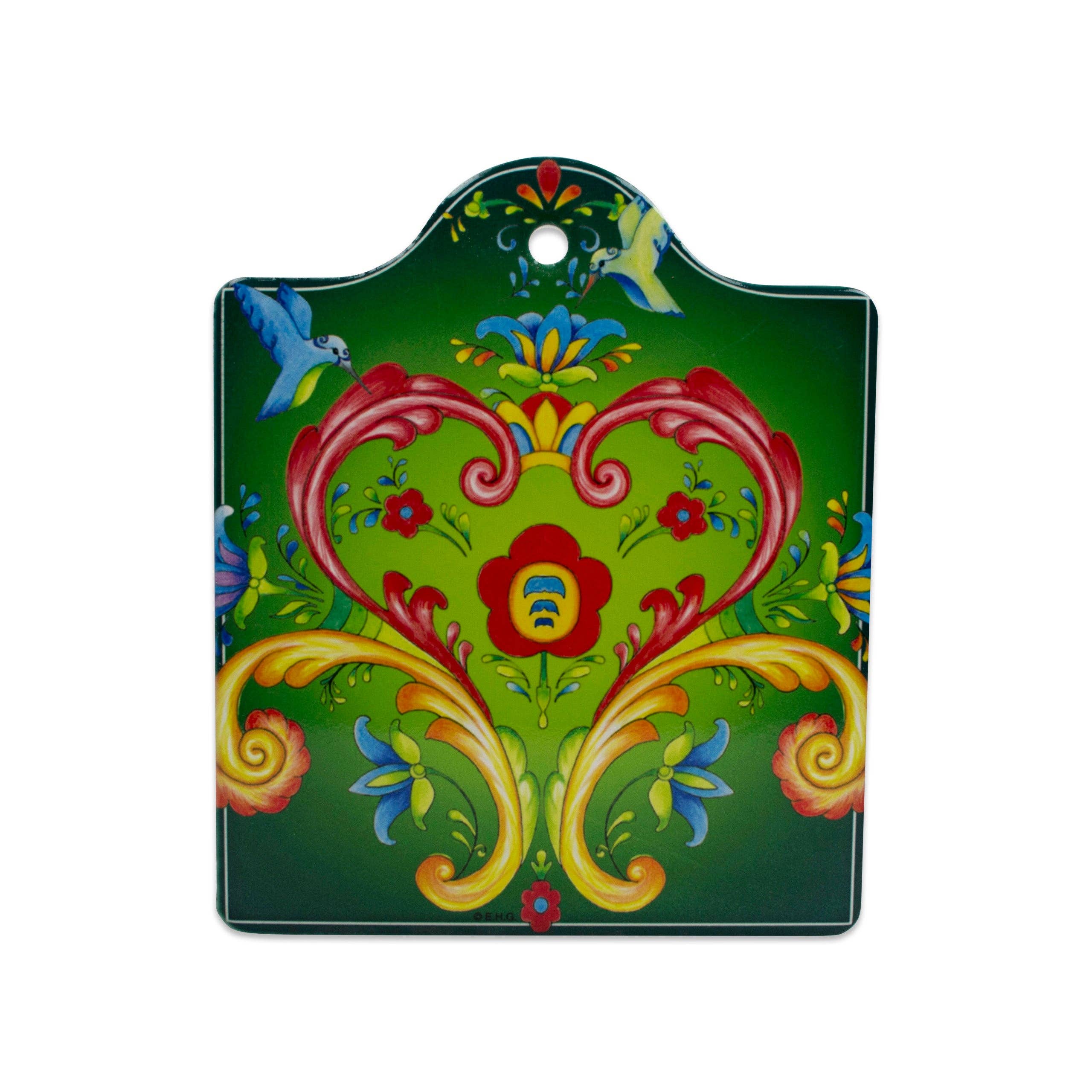 The Tile: Rosemaling Green Ceramic Cheeseboard Kitchen Trivet features red, yellow, and blue floral and heart patterns with two blue birds on a green background—ideal for adding Scandinavian charm to your kitchen decor.