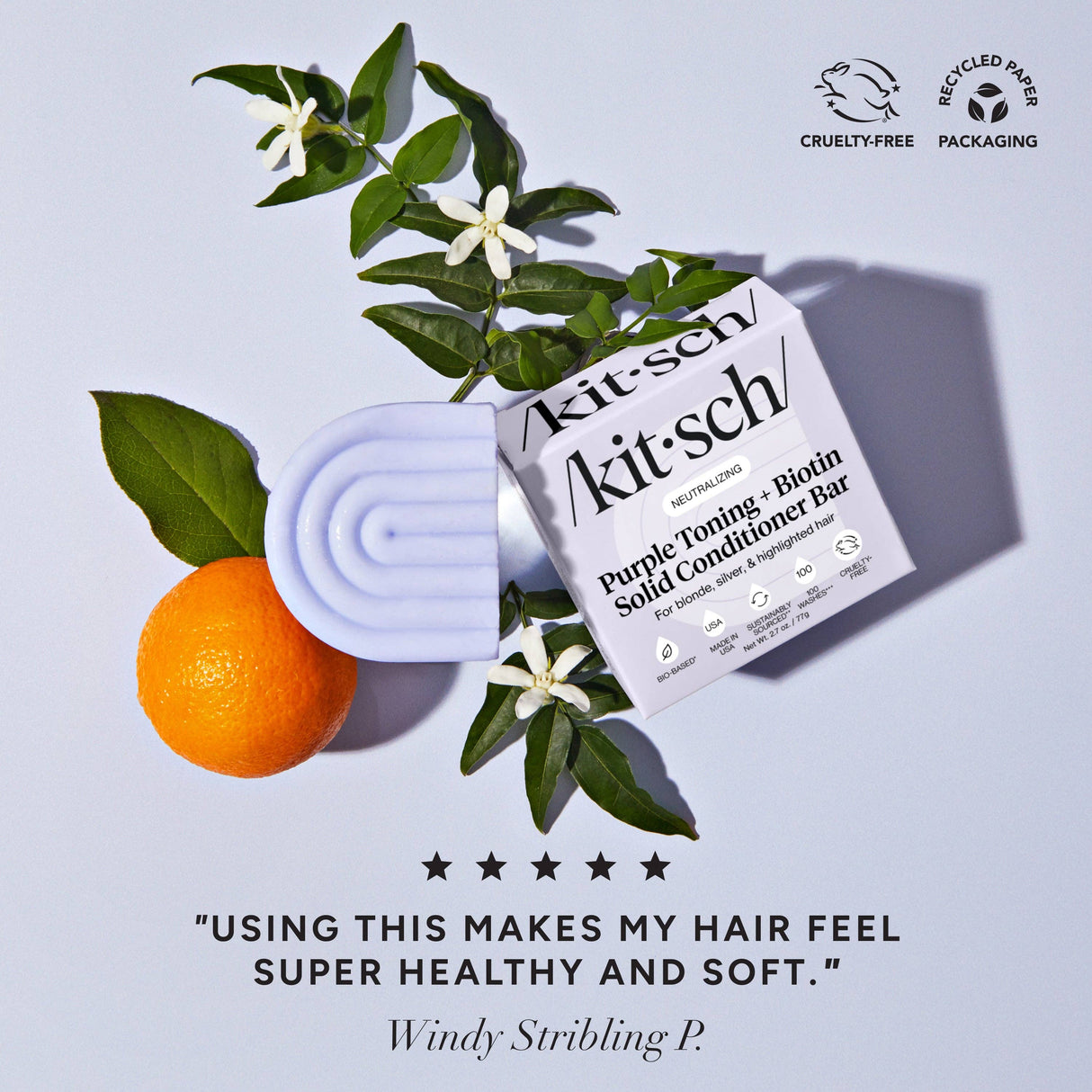 The Kitsch Hair: Purple Toning Shampoo & Conditioner Bar Combo for Color-Treated & Grey Hair is shown with an orange, green leaves, and white flowers, featuring a user review praising its effect on color-treated hair.
