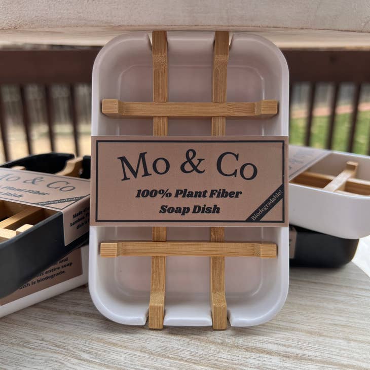 This eco-friendly accessory, the Soap Dish: Plant Fiber White, features slats and a design by Mo & Co to offer a plastic-free solution for keeping your soaps dry and fresh.
