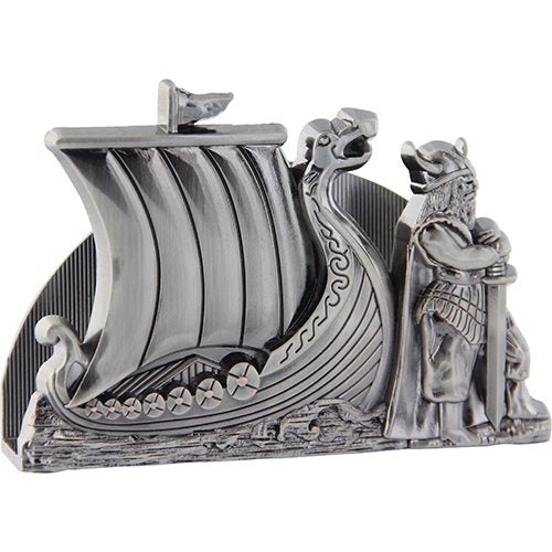 The Pewter Viking Ship Napkin Holder features a dragon-shaped prow, intricately designed sail, and a Viking warrior with a sword. It is perfectly sized to serve as a unique card holder for your desk.