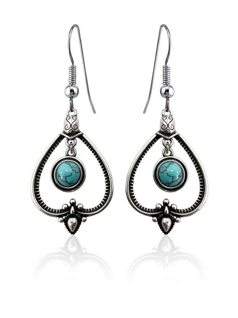 Handcrafted sterling silver earrings with teardrop frames and round turquoise stones—perfect for those who love Sterling Silver with Turquoise Drop Earrings.