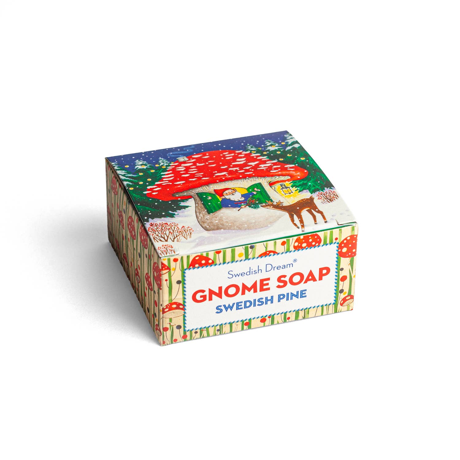 A box of Swedish Dream Gnome Soap offers a refreshing Swedish Pine scent, with packaging that beautifully depicts a magical slice of nature, showcasing a gnome, a mushroom house, and a reindeer nestled in a snowy forest scene.