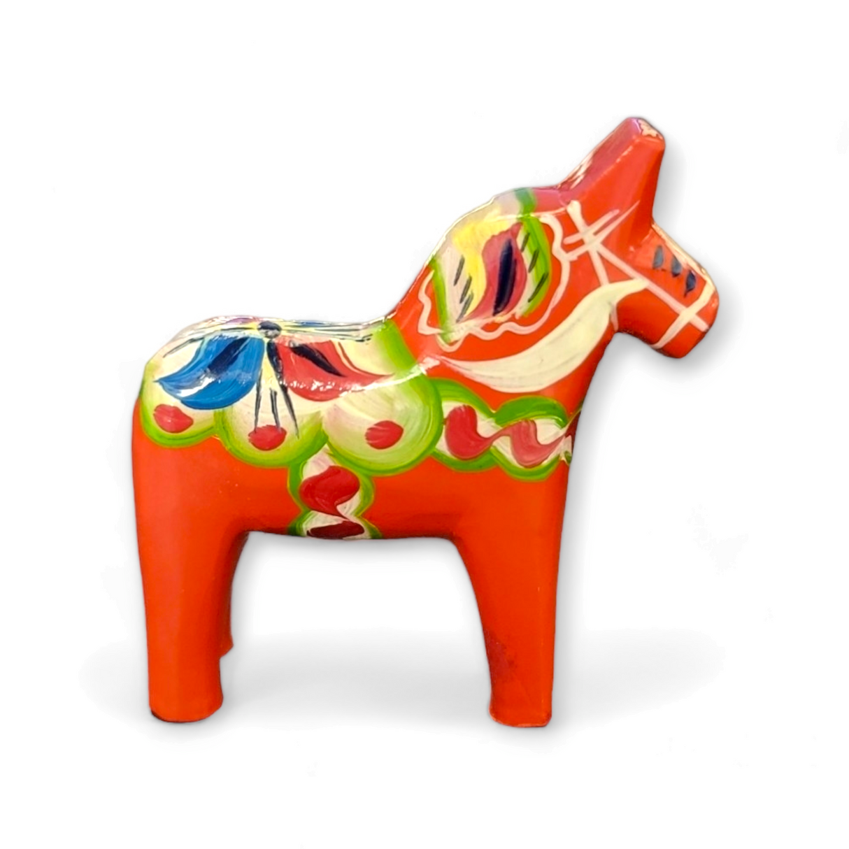 The Dala Horse: Red Swedish Dala Horses – Handcrafted in Sweden (Various Sizes) is a small, red wooden horse with colorful green, white, blue, and yellow patterns—an authentic handcrafted Swedish collectible.