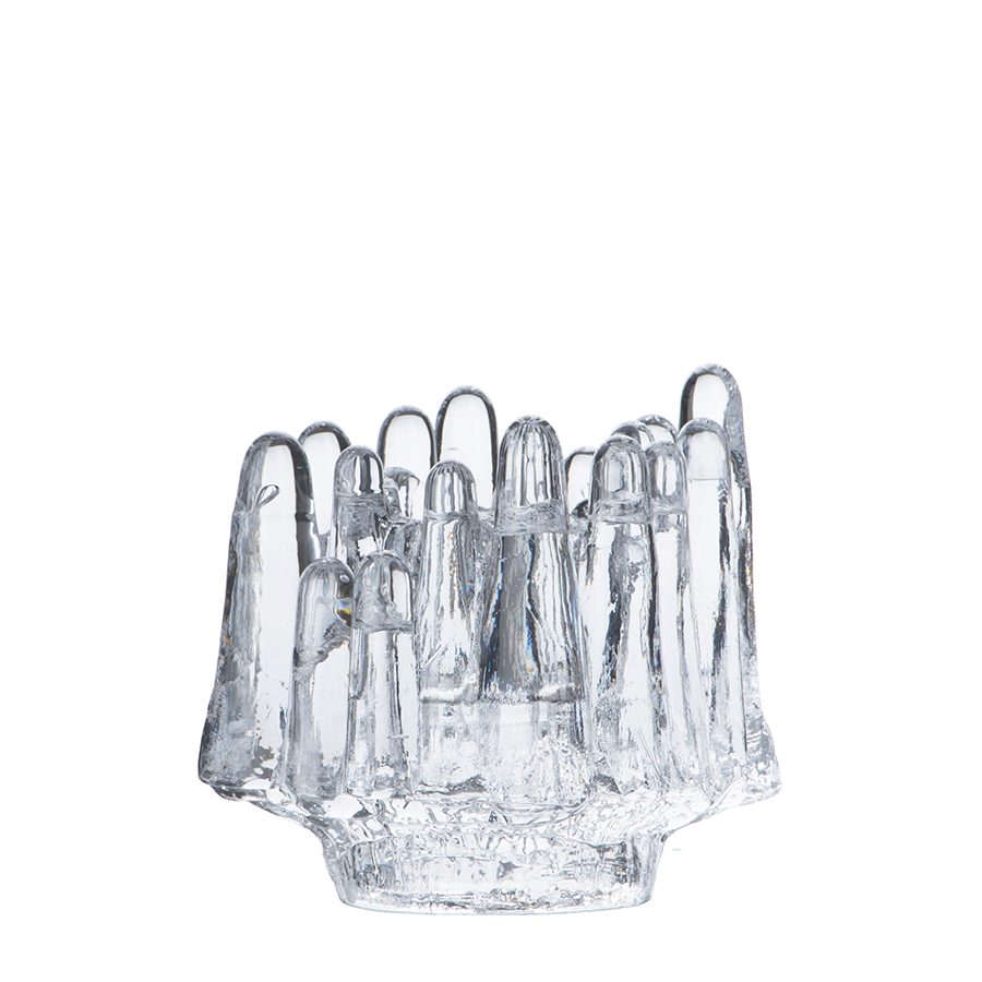 The KostaBoda Polar Votive Clear Medium (112mm x 108mm) features abstract, elongated glass forms arranged in a circular pattern, evoking the look of ice formations.