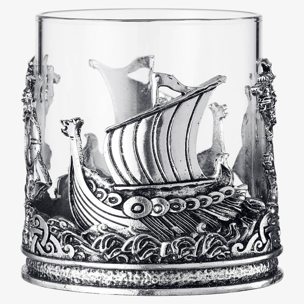 The 12 OZ Viking & Mythological Whiskey Drinking Glass features a clear design with ornate silver ship and wave motifs wrapping elegantly around its base and sides.