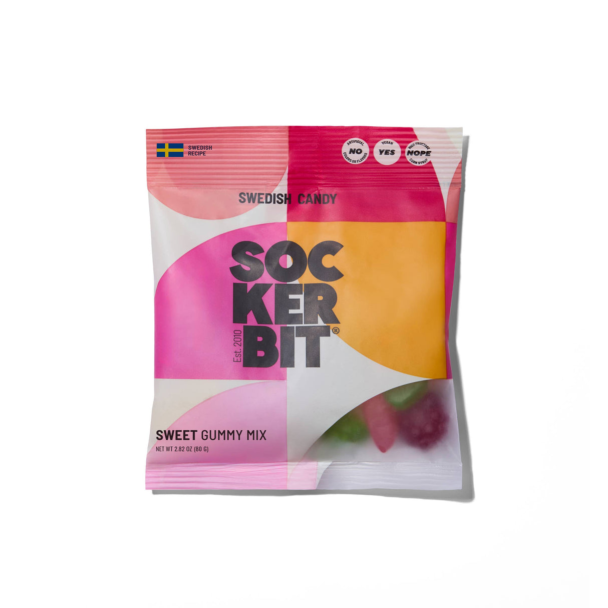 A vibrant pink and orange geometric bag labeled "Candy: Sweet Gummy Mix Swedish Candy Bag by Sockerbit 2.8oz" shows assorted non-GMO gummy candies through the packaging. Brand: Sockerbit.