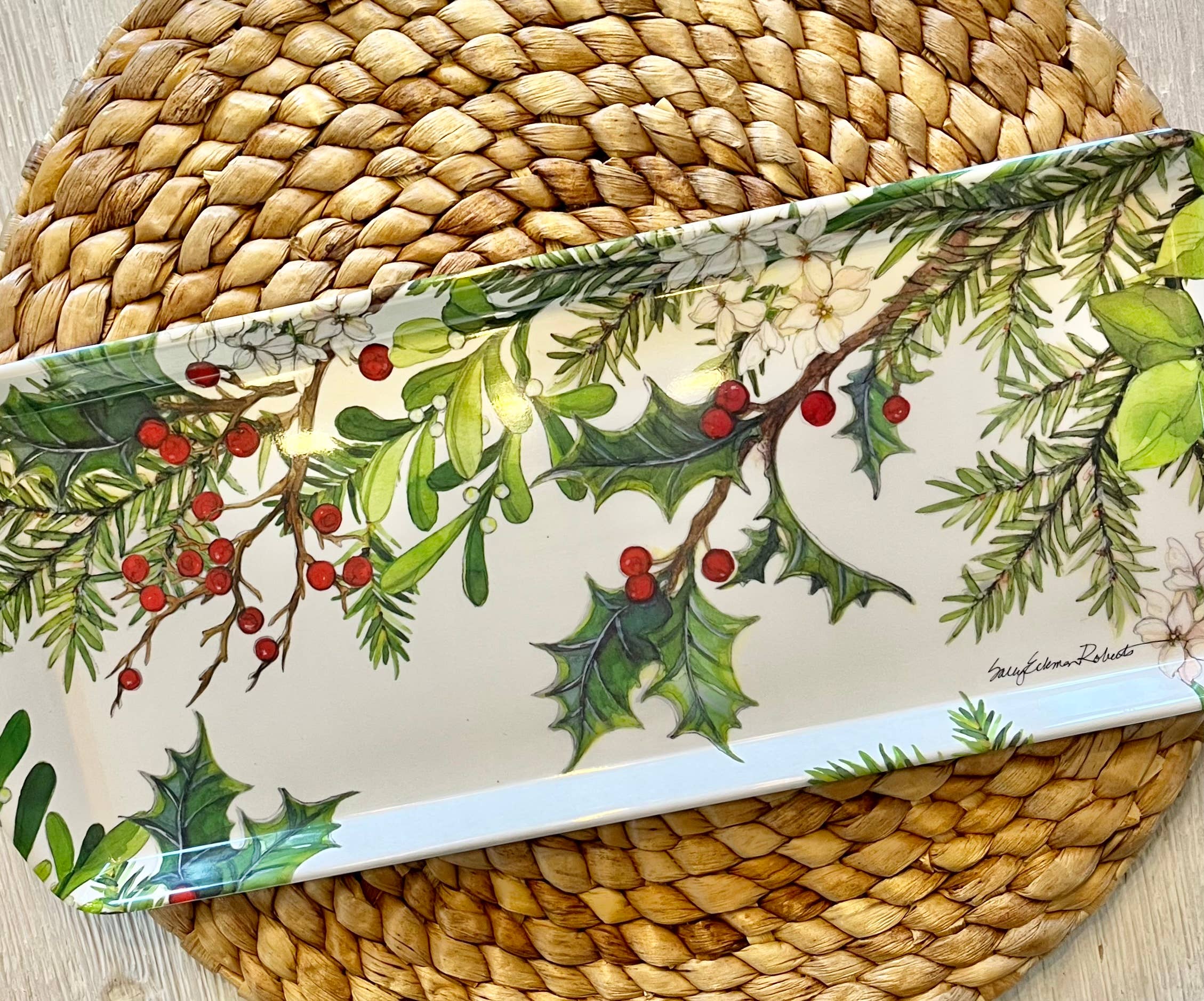 The Tray: Holly & Berries Holiday Serving Appetizer, Almond Cake, Bread Loaf Tray rests on a round woven placemat.