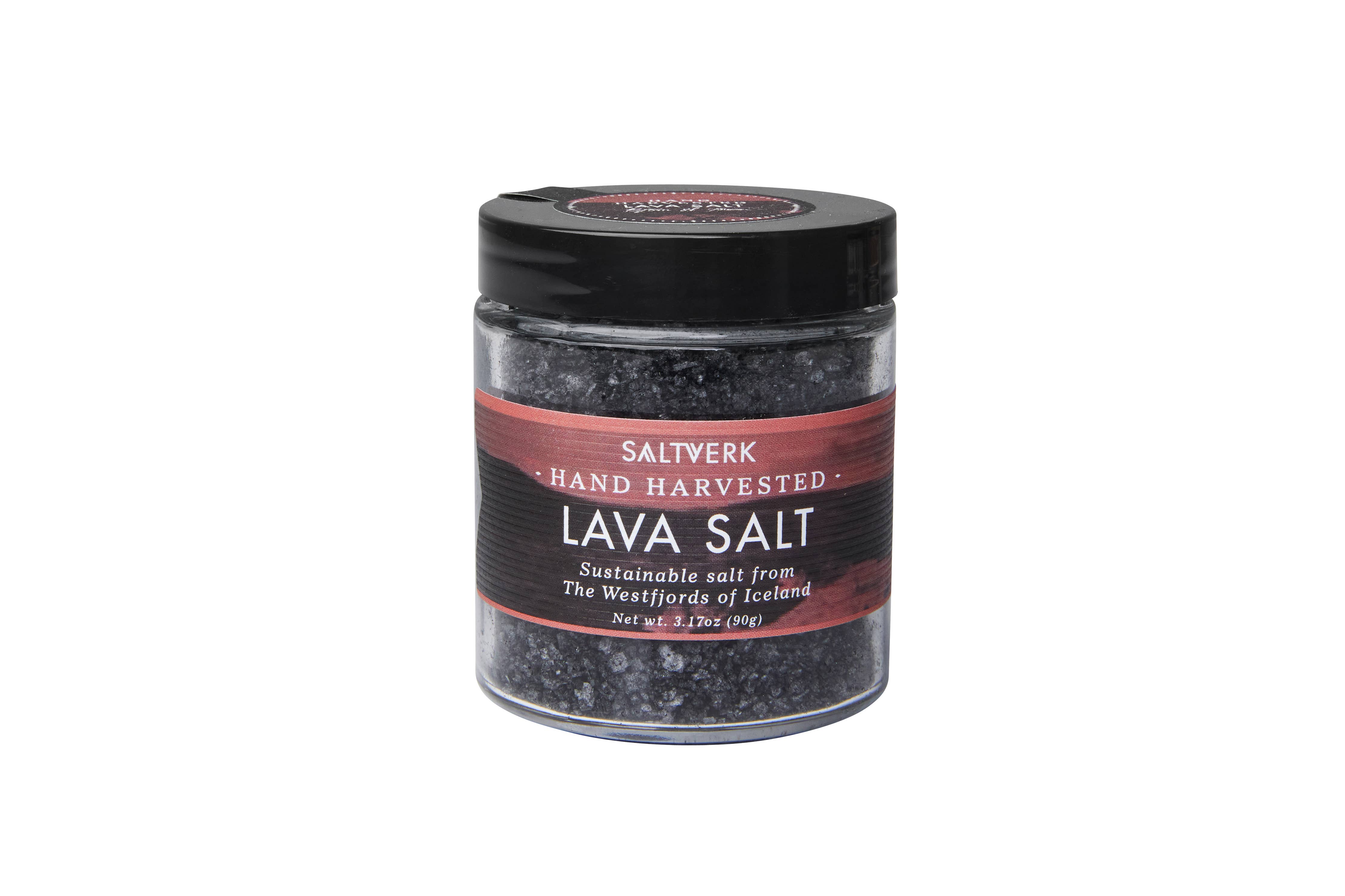 A clear jar from the SALTVERK Gift Set contains hand-harvested Icelandic Lava Salt, with a black lid and a red-black label describing its sustainable Icelandic sea salt origins.