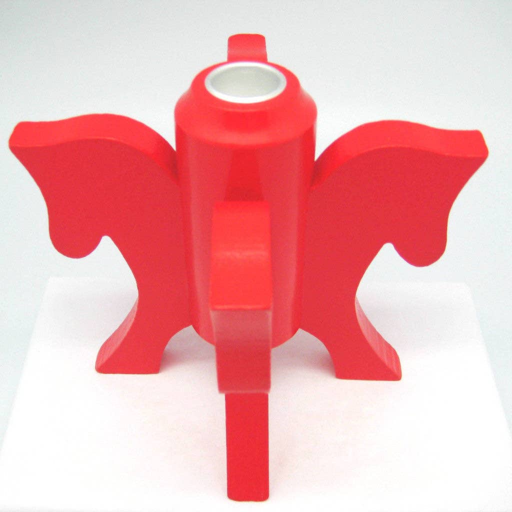The Swedish Red Dala Horse Candle Holder features four horse heads in an abstract design with a cylindrical center, ideal for Scandinavian decor and displayed on a white surface.