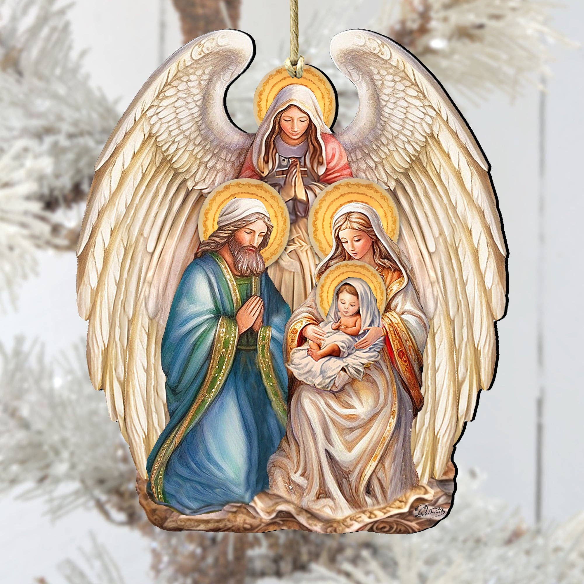 The Ornament: Angel with Nativity Family Wooden Christmas Tree Ornament by G.Debrekht (5x4 inches) features an angel watching over Joseph, Mary, and baby Jesus, adding warmth and beauty to your holiday décor.