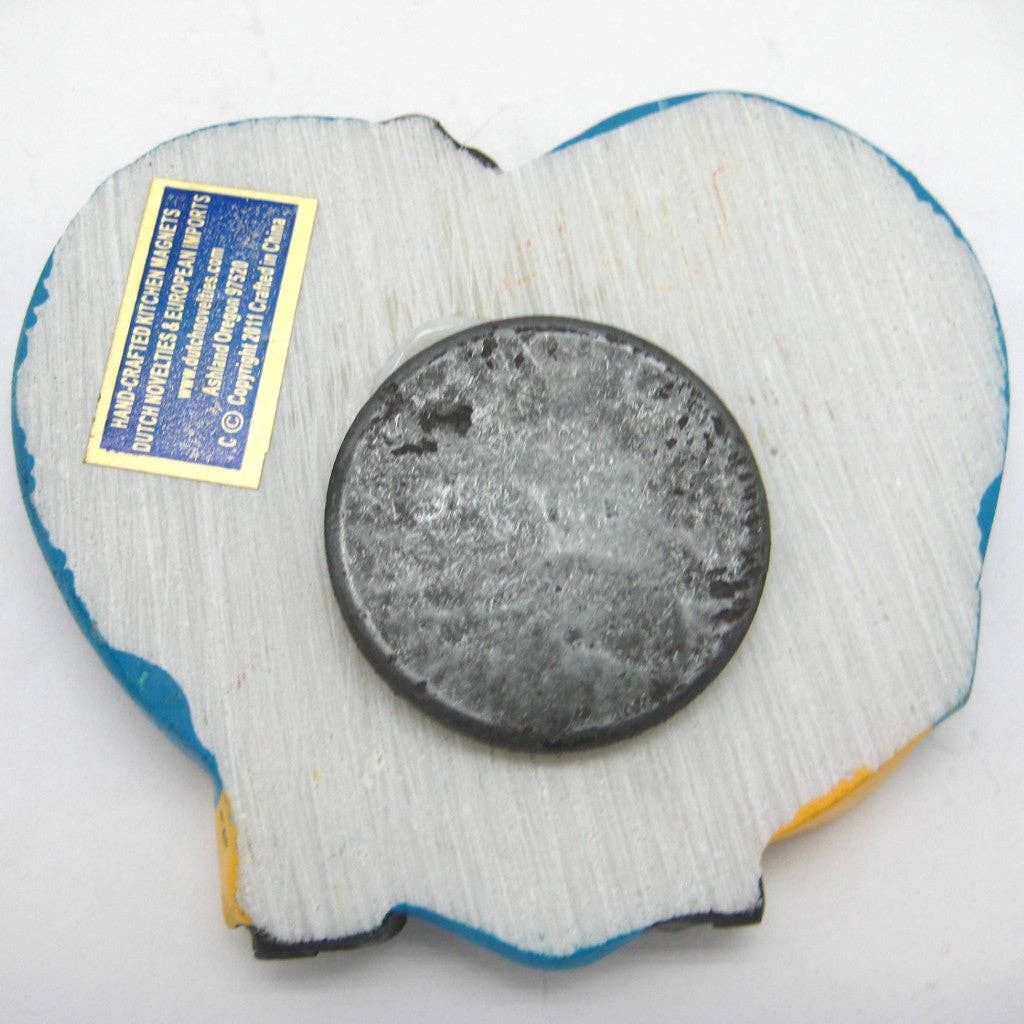The Magnet: Swedish Kissing Couple Party Favor Kitchen Magnet, with its heart shape and charming clay design, features a distinctive blue border and a worn circular center. Its back holds a label bordered in yellow, making it an ideal novelty gift. This magnet is perfect for complementing your Swedish Kissing Couple collection at home!