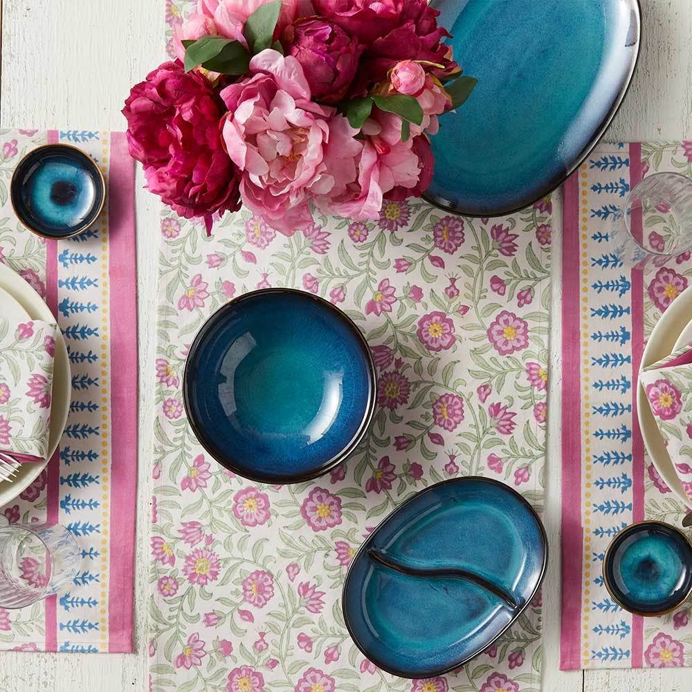 Table set with blue ceramic dishes, featuring the handmade Lake Life Ceramic Divided Oval Dish, a pink floral centerpiece, and a floral-patterned table runner in blue and pink accents.