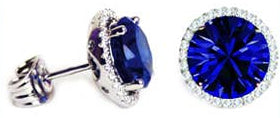 Handmade silver solitaire studs featuring round sapphire blue Swarovski crystals, reminiscent of the September birthstone, and accented with small clear stones for added sparkle.