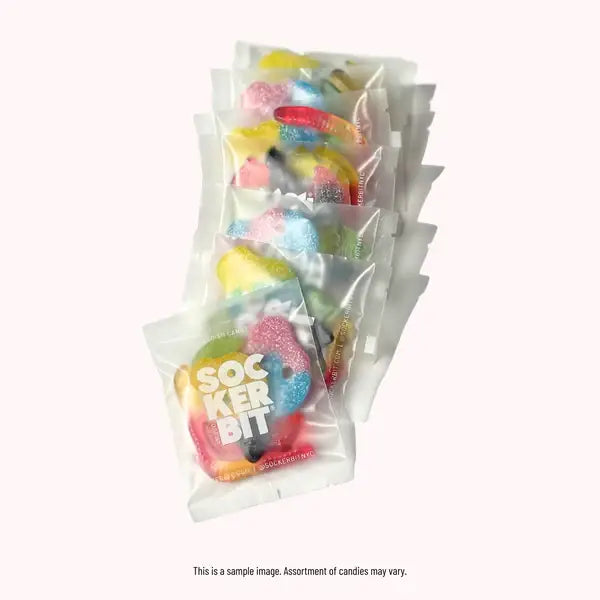 Five clear 1.6 oz Sockerbit Single Serving Bags of assorted Swedish candy stacked diagonally on a plain white background—always GMO free and perfect for a sweet treat.
