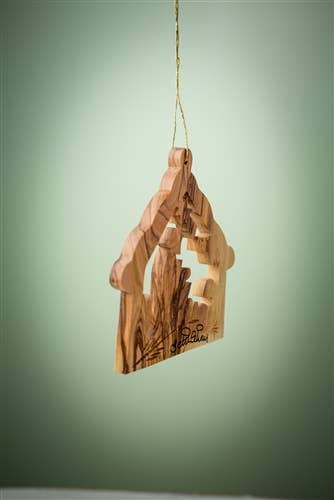 The "Stable with Nativity and Animals" 3" Christmas tree ornament hangs from a gold string against a green background.