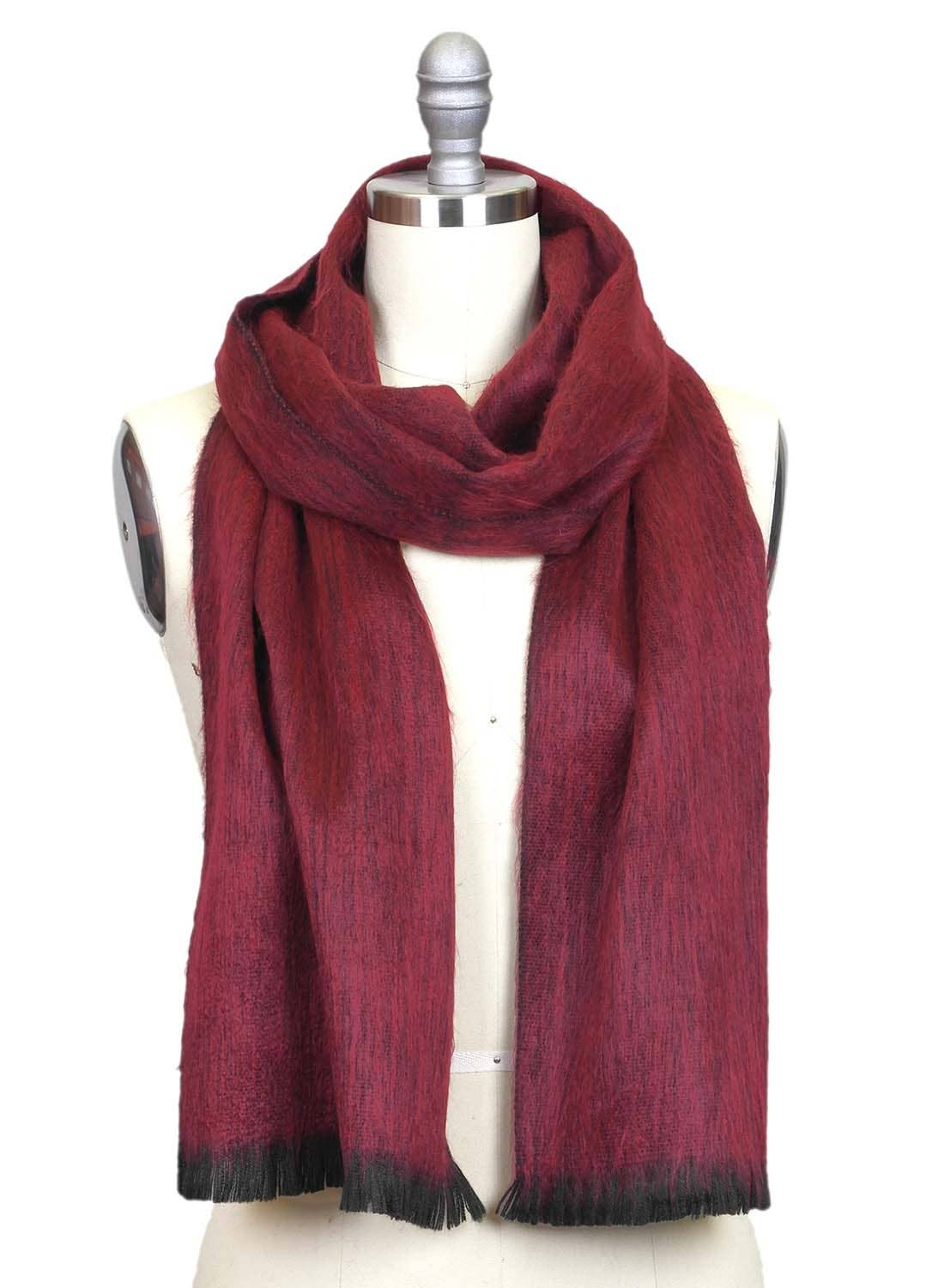A mannequin showcases the Alpaca Scarf in Sapphire Red with Black Fringe, draped loosely for a soft, unisex look.
