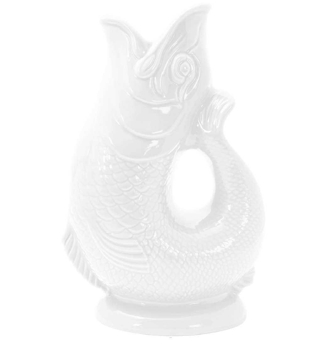 The Gluggle Jug is a white, fish-shaped ceramic pitcher handmade in the UK, featuring an open mouth and detailed scales—it gluggles when you pour.