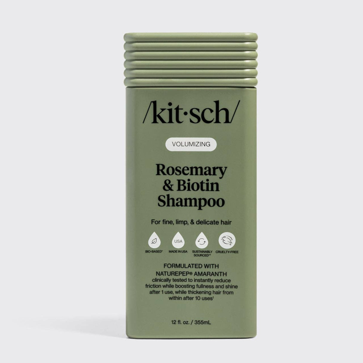 Olive green bottle of Kitsch Hair: Volumizing Rosemary & Biotin Shampoo 12oz for fine, limp, and delicate hair, featuring nourishing biotin and rosemary with certification icons and product details on the front label.