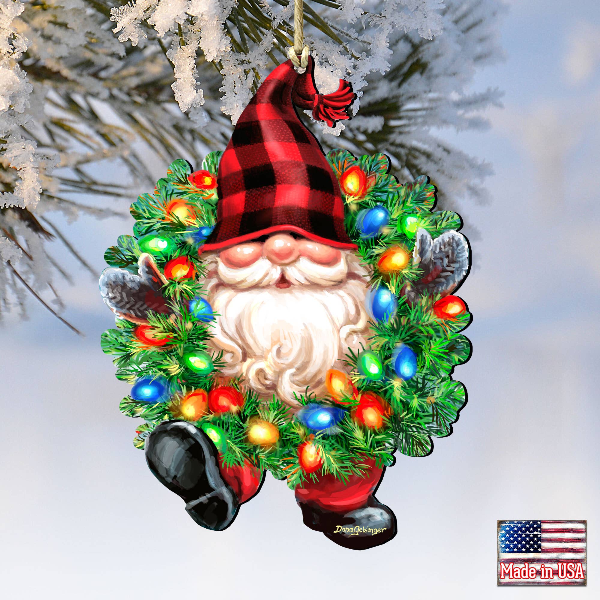 The Bright Light Gnome Ornament by D. Gelsinger (5.5x4.5") features a red plaid hat, colorful lights, and an American flag Made in USA label, making it a charming handcrafted addition to your Christmas tree.