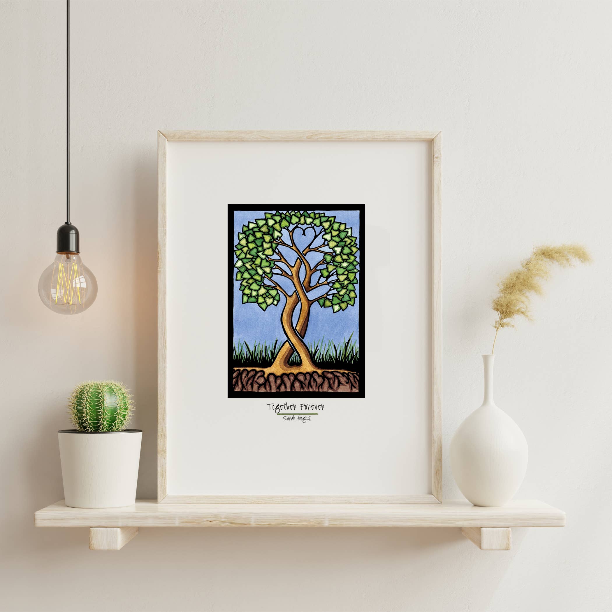 The beautiful "Together Forever Tree" artwork, measuring 11"x14", features a captivating heart-shaped canopy that enhances the appeal of your shelf. It's perfectly complemented by a cactus, vase with grass, and a hanging bulb. This Giclee Art Print serves as an ideal Valentine's Day gift for any art enthusiast.