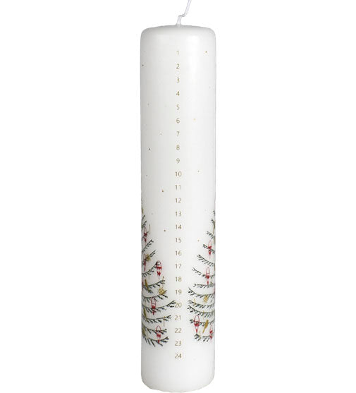 The Candle: Advent Pillar Candle with Christmas Tree is a 9.5" tall, 2" diameter white candle numbered 1–24 vertically, featuring green branches and red berries near the base for a festive Scandinavian touch.