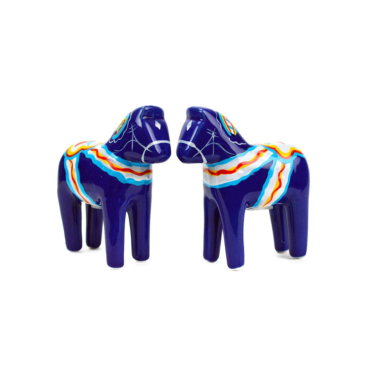 The Shaker: Blue Swedish Dala Horse Salt and Pepper Shakers feature colorful patterns and face each other on a white background, making them perfect for Scandinavian kitchen decor.