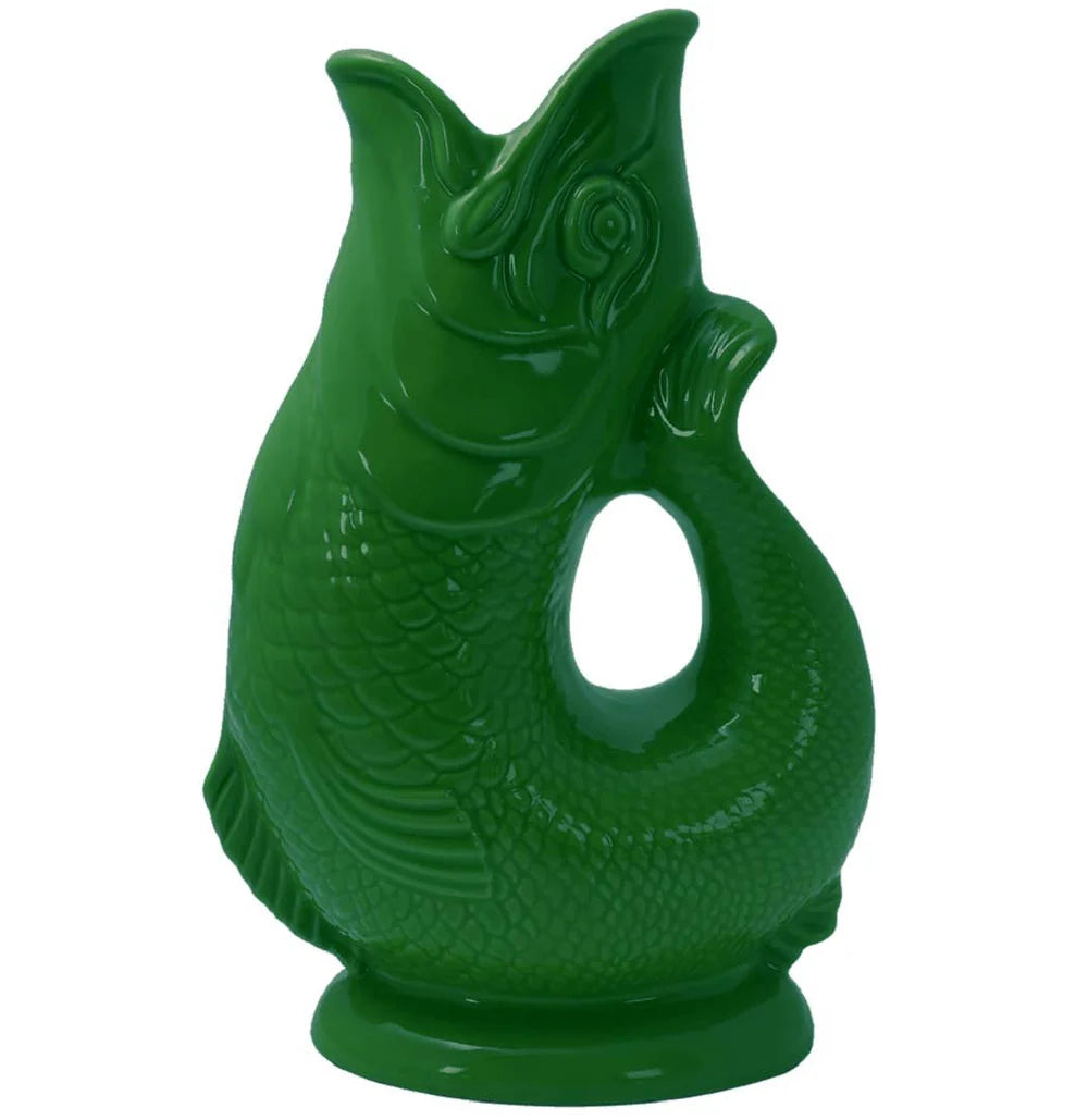 The Classic Gluggle Jug is a green ceramic, fish-shaped pitcher with an open mouth and a large handle—perfect for adding British charm to any kitchen.