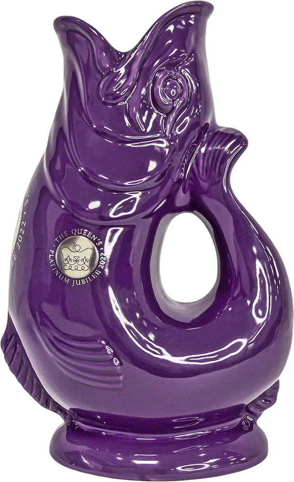 The Classic Gluggle Jug is a glossy purple, fish-shaped ceramic jug with an open mouth and handle, featuring text for The Queen’s Platinum Jubilee 2022—an iconic piece of British kitchen decor.
