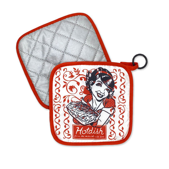 Set includes two potholders: one plain silver quilted, and the "Hot Dish" red and white potholder with hanging ring by Adam Turman, featuring a retro woman holding a casserole and “Hot Dish” printed below.