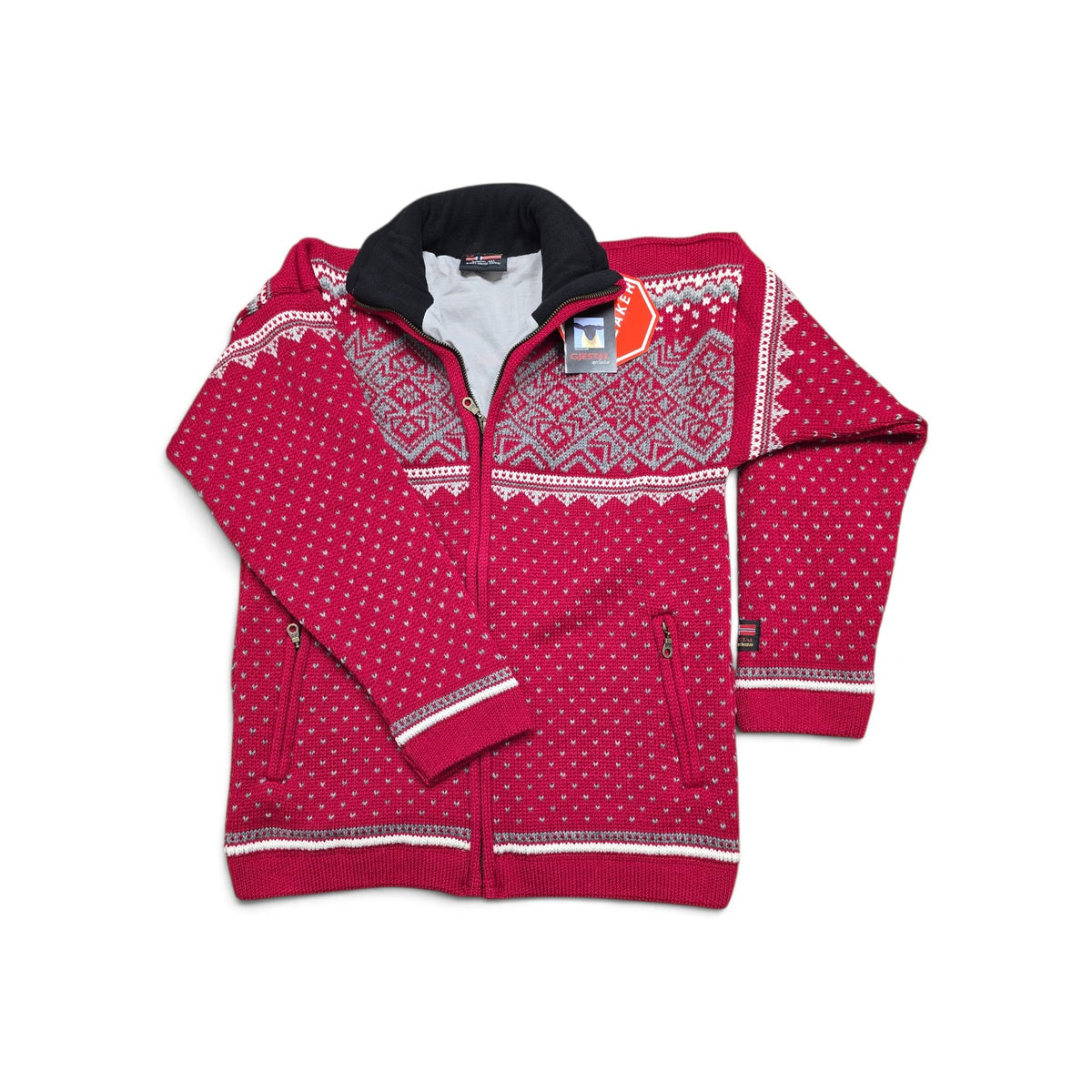 Red zip-up knit sweater featuring a Nordic pattern across the chest and shoulders, a high collar, and two zippered pockets.