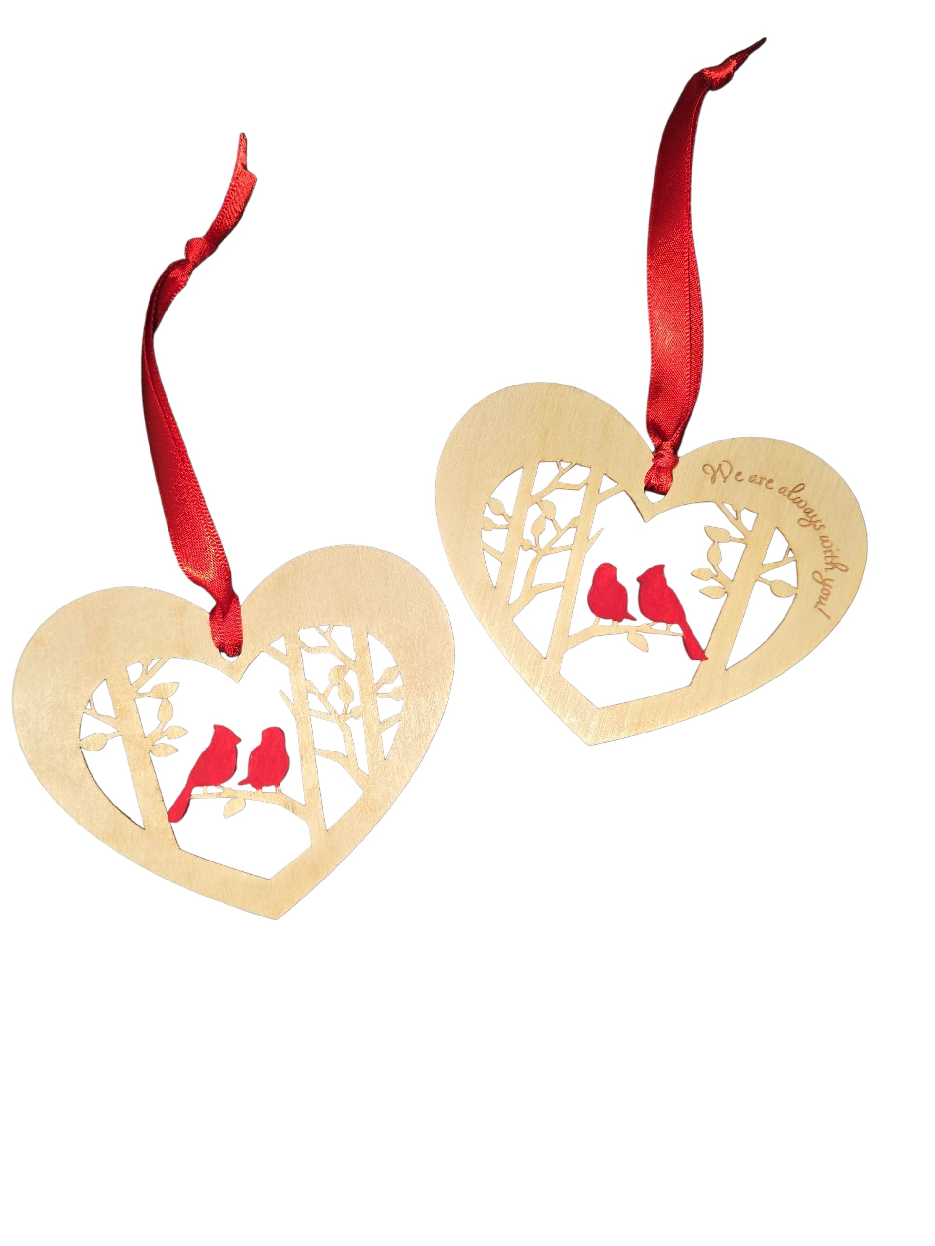 Set of two heart-shaped laser-cut birch ornaments (3.75" × 3.25") featuring two cardinals on a branch and the message “We are always with you,” making a heartfelt memorial keepsake.