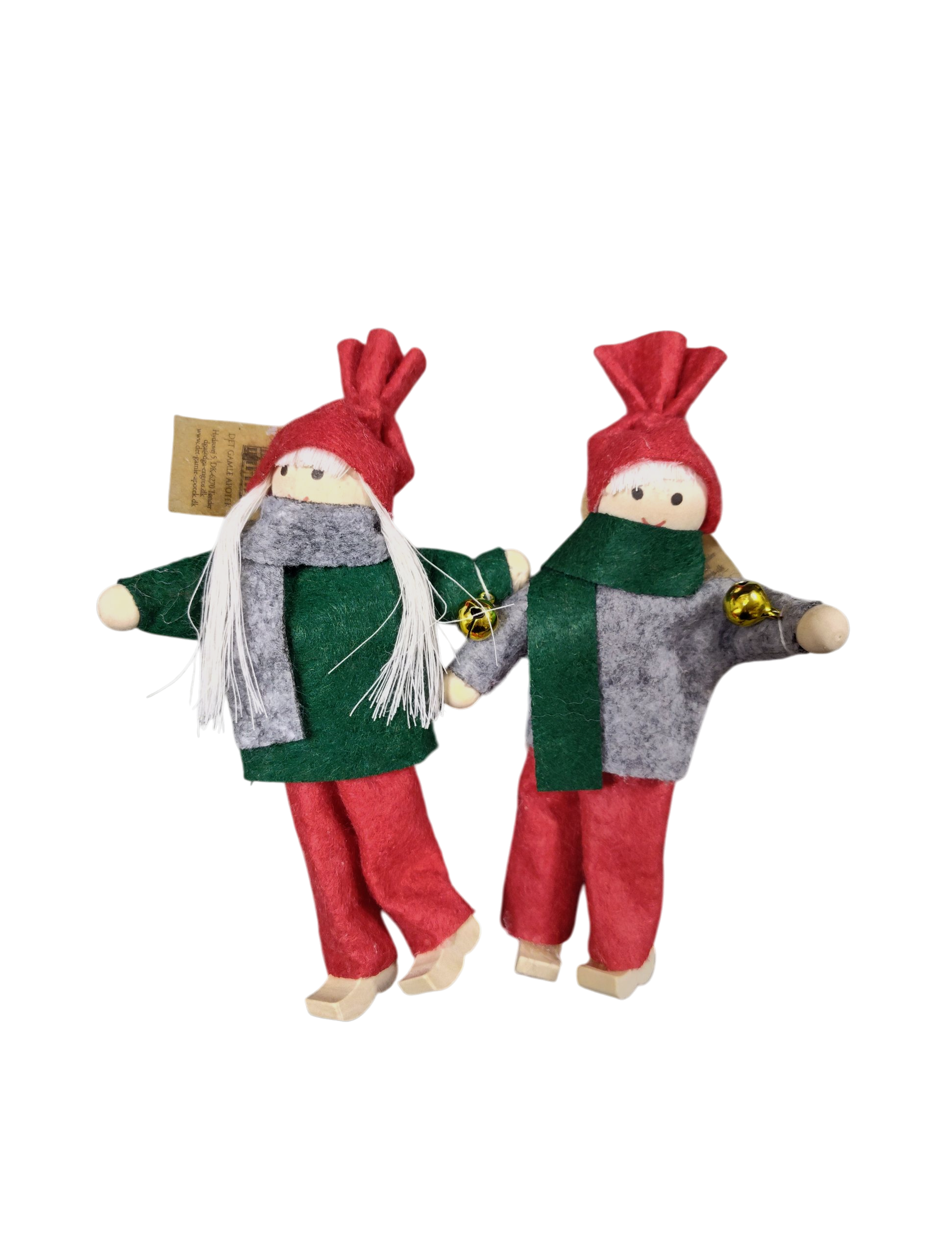 A Swedish Tomte girl or boy Christmas tree ornament, handmade and dressed in red and green with wooden clogs, adds Scandinavian charm to your holiday décor.
